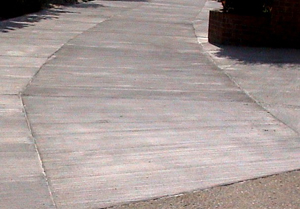 Damaged driveway repaired with Fusion-Crete concrete repair product and concrete resurfacing product